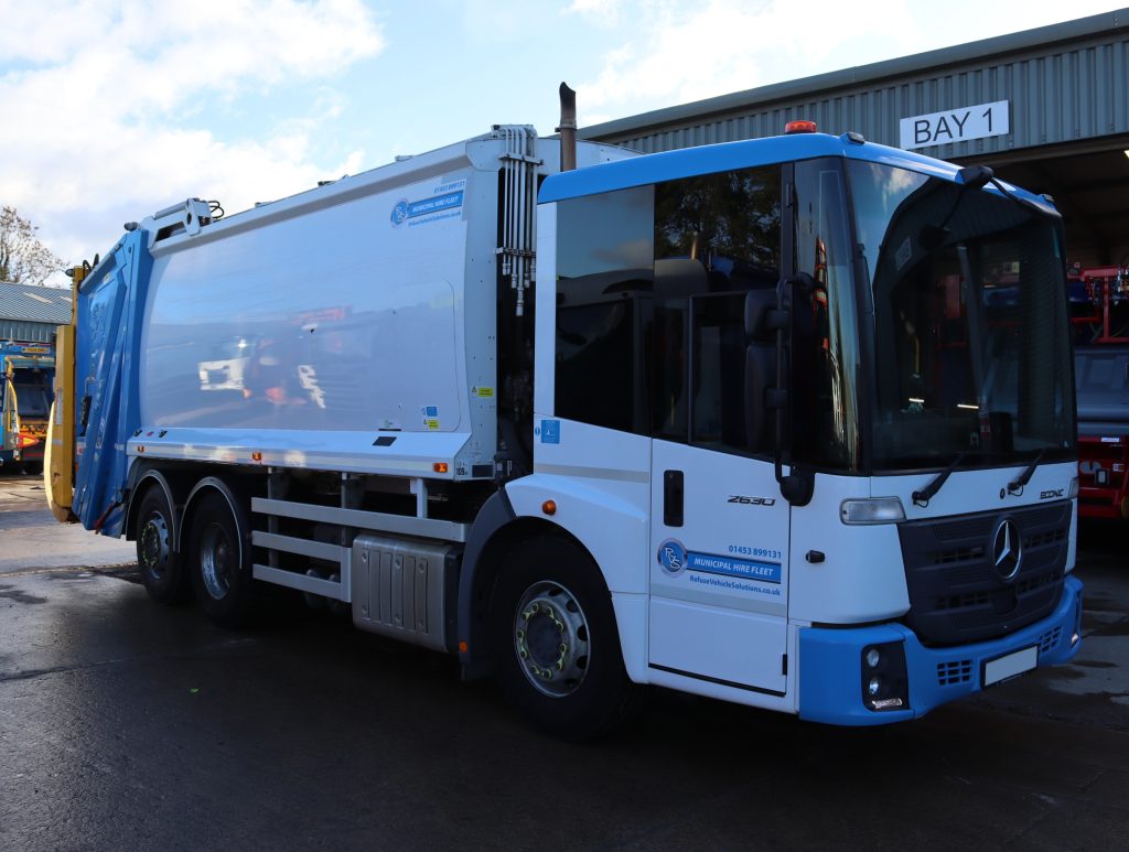 Front offside of a Mercedes Econic 2630L fitted with Dennis OL21W body and Beta 2 trade lift
