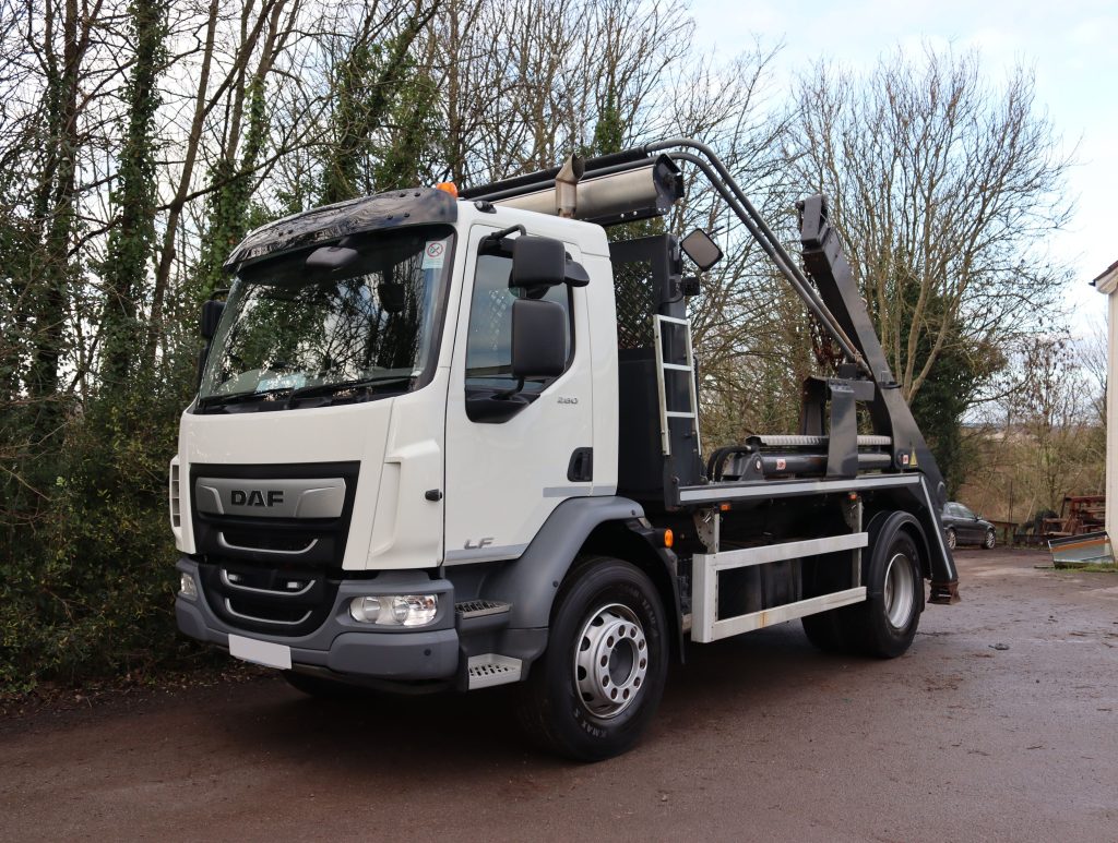 Front nearside of a DAF LF 260 fitted with AJK SLK12-T Skip Loader body