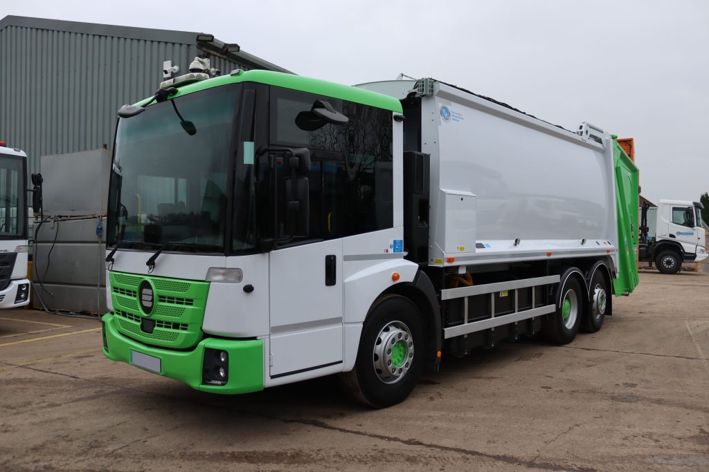 Front nearside of an Electric Conversion Mercedes Econic 2630L fitted with a Dennis Olympus OL21W body and Terberg OmniDEL Domestic lift