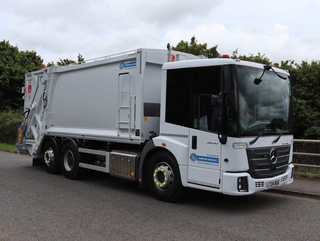 Front offside of a Mercedes Econic 2630L chassis fitted with MOL Pusher 4000 body and CB011 Trade bin lift