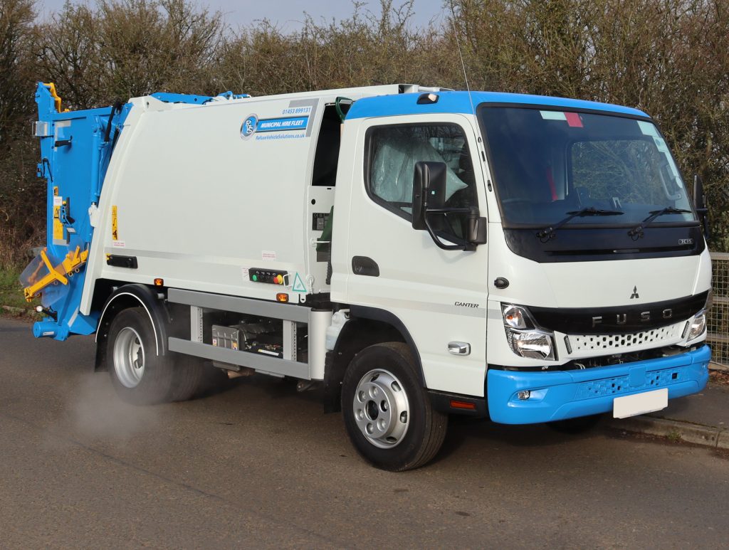 Front offside of a Mitsubishi Fuso Canter fitted with NTM K-Midi body and NTM Trade lift