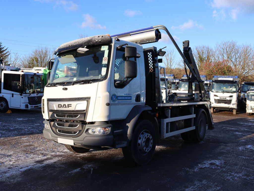 Front nearside of a DAF LF 260 fitted with AJK SLK12-T Skip Loader body